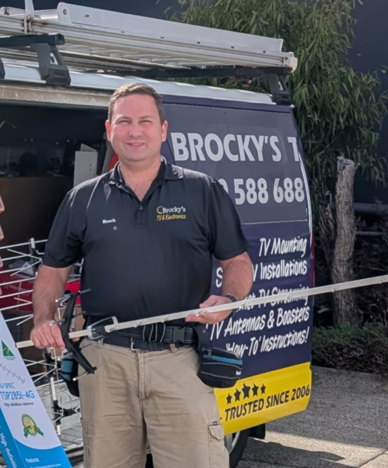 Expert TV antenna installer in Sunshine Coast holding antenna equipment