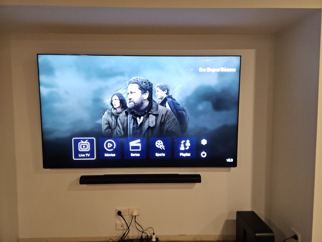 Wall-mounted smart TV with soundbar installed in a modern home on the Sunshine Coast.