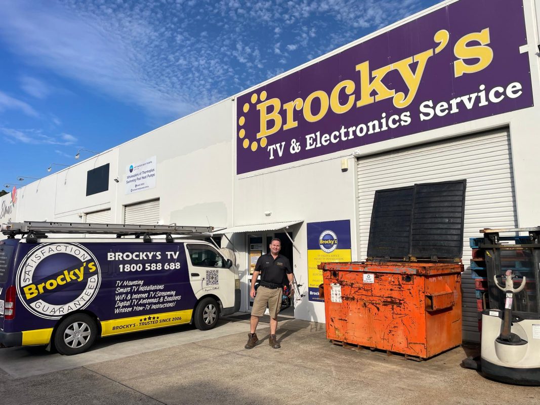 Brocky’s TV Sunshine Coast van and technician outside store offering TV and WiFi services.